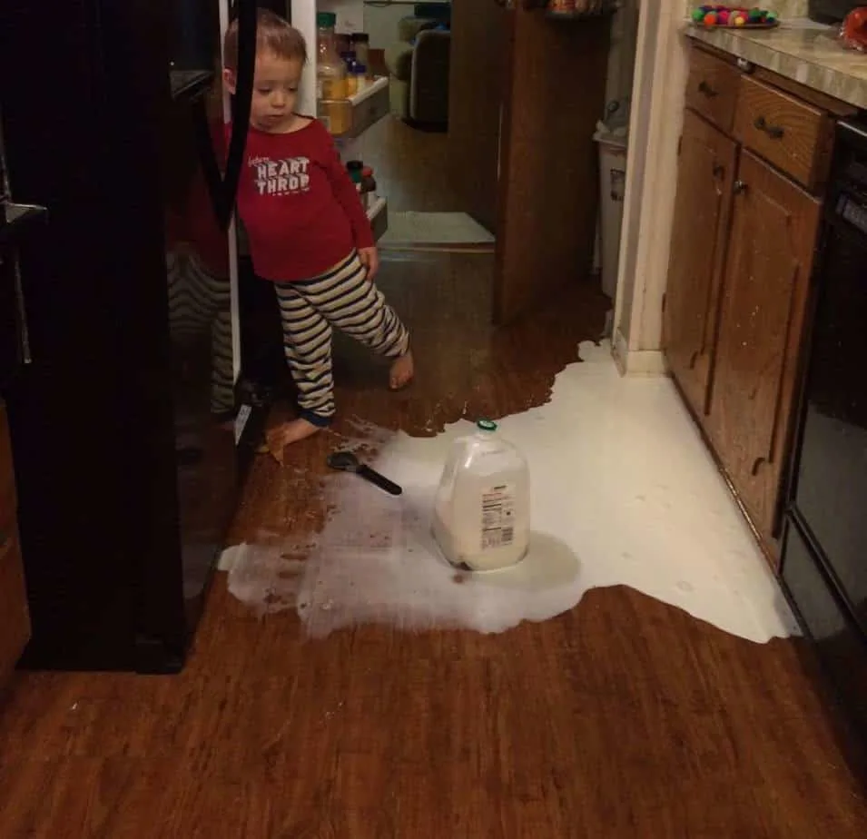 parenting boys - baby with spilled milk