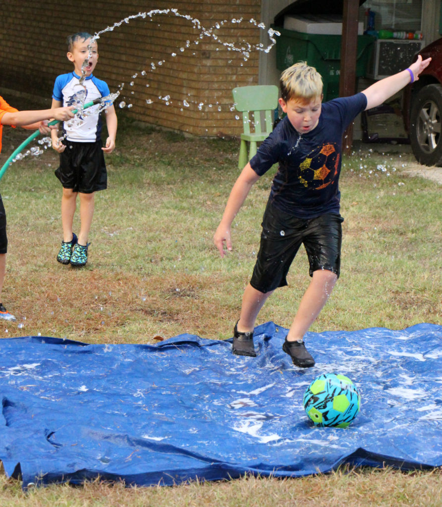 Awesome Ideas to do with the Kids on Your Family Camping Trip water soccer goliath ball