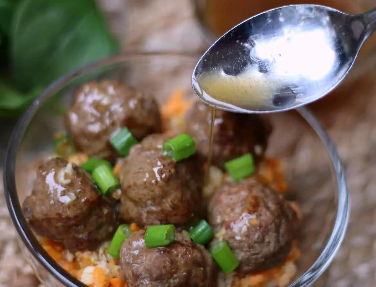 whole30 meatballs and gravy over riced veggies