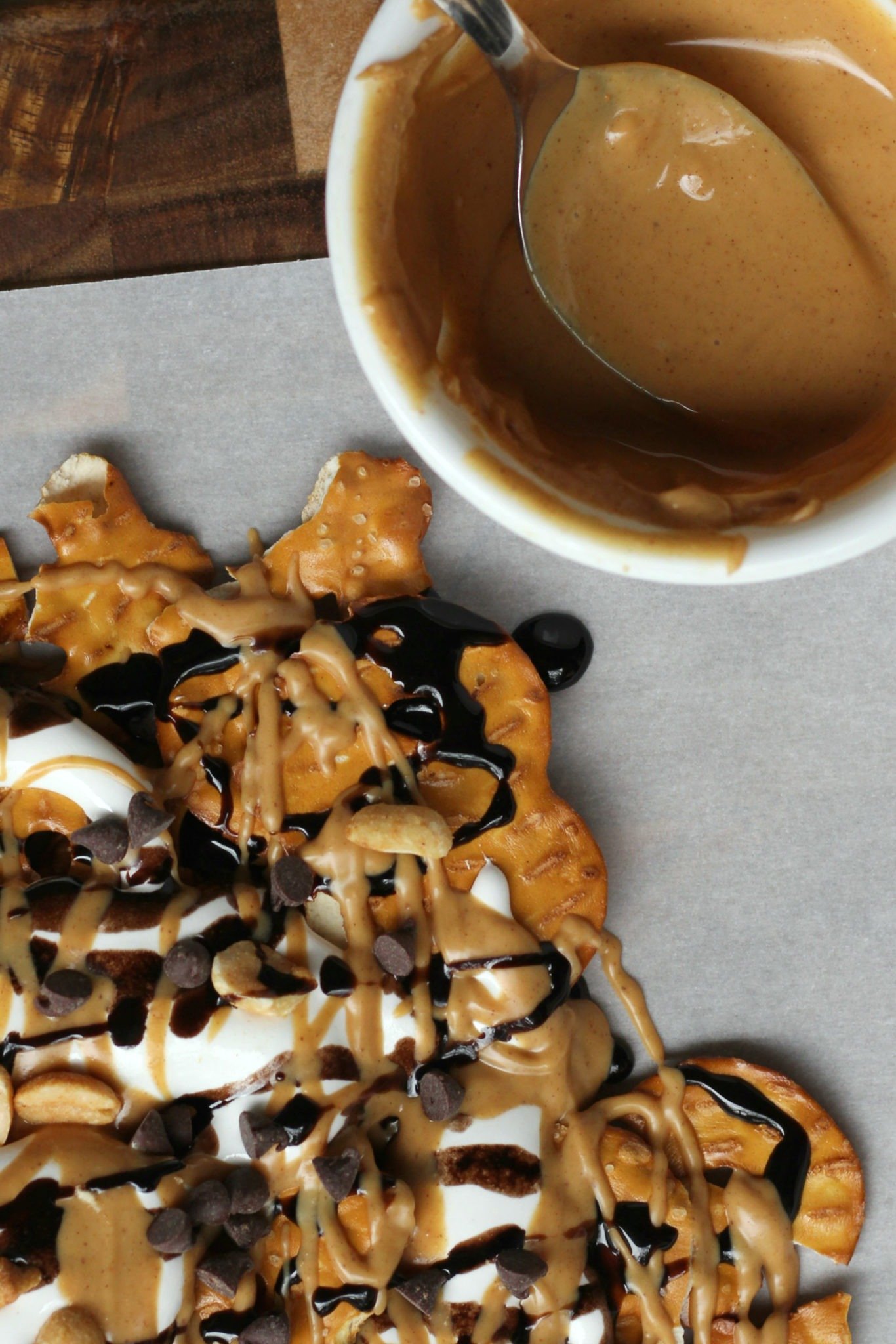 Pan of peanut butter dessert nachos, covered in chocolate, peanut butter, and marshmallow cream.