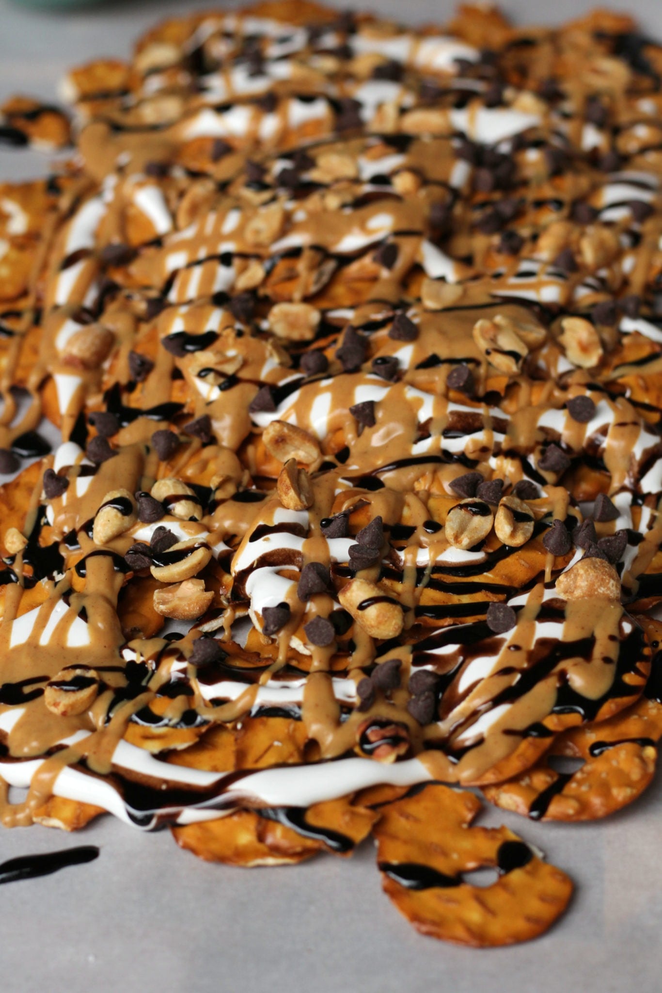 Pan of peanut butter dessert nachos, covered in chocolate, peanut butter, and marshmallow cream.