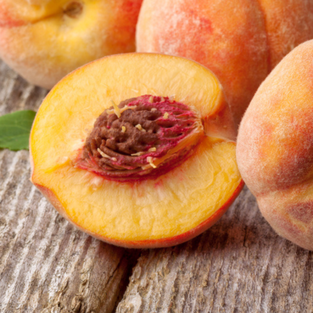 how to freeze fresh peaches - close up of peaches, one cut