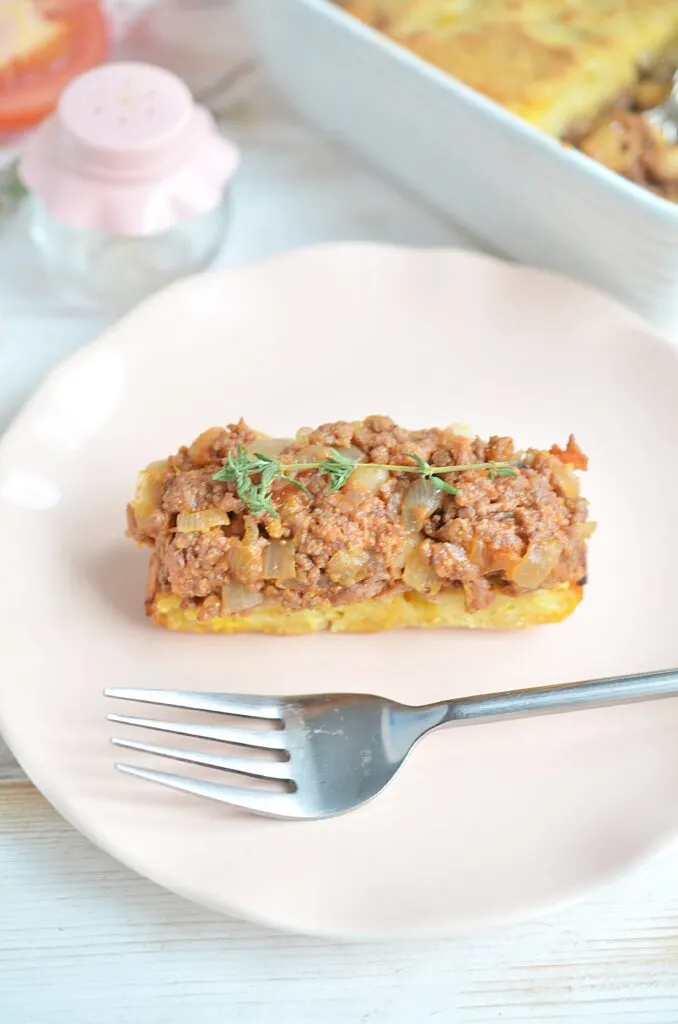 slice of cornbread casserole with a fork