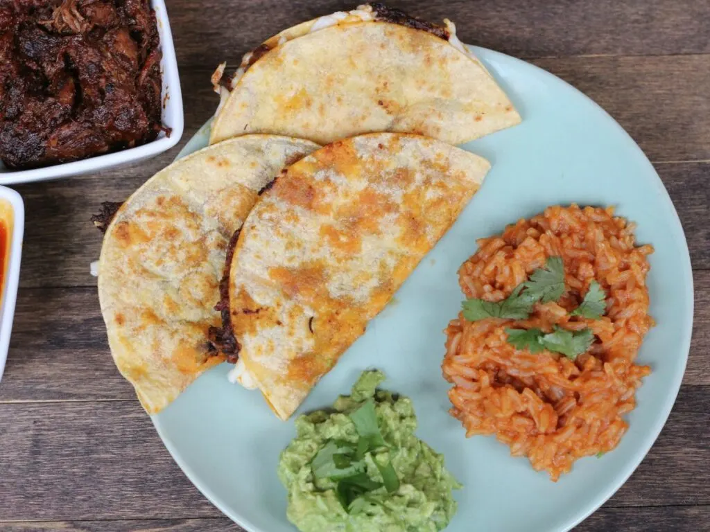 quesabirria tacos with rice and guacamole