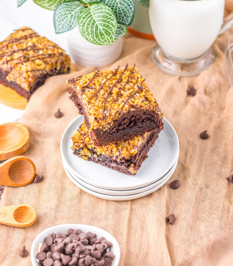 two samoa brownies with chocolate and caramel on a plate